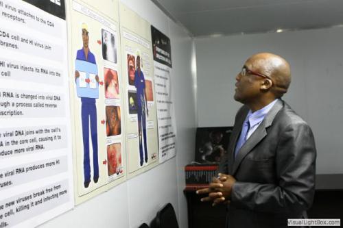 dr aaron motsoaledi looking at the educational material inside the centre